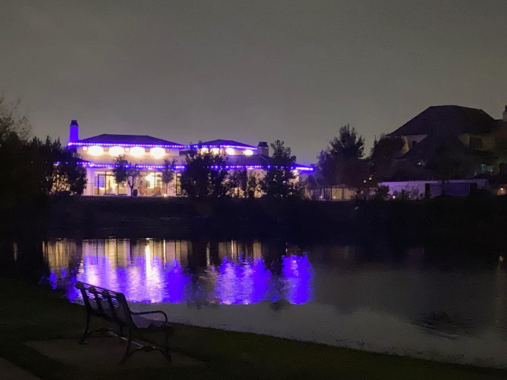 Purple lights reflecting beautifully in lakeside setting